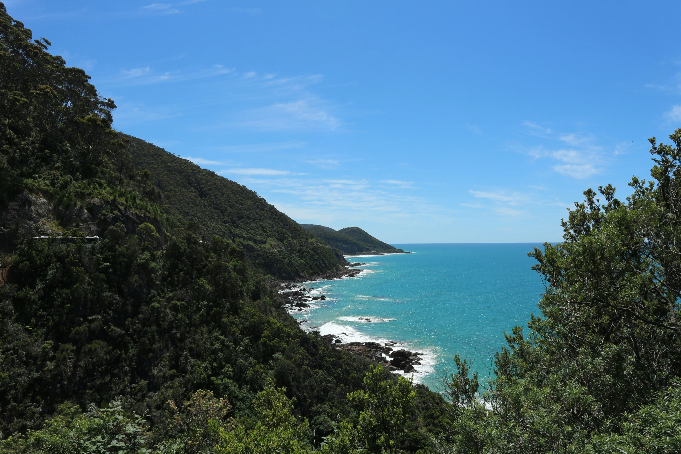 a beautiful blue ocean with a white sky