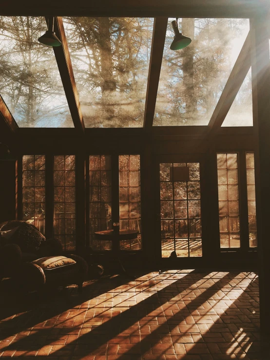 a sun light shines through the sunlit windows of a cabin