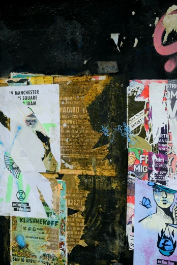 various posters on a wall in front of them