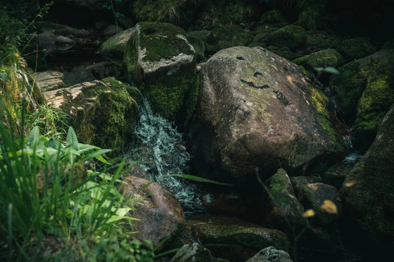 water cascading between rocks in a stream