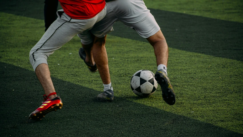 the soccer player has one foot on the ball