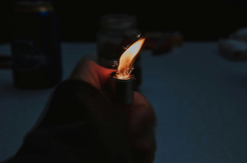 a lit flame from an electronic lighter