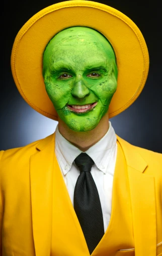 a person wearing a hat and bright green makeup