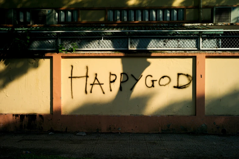 a painting with words happy god is written on a wall