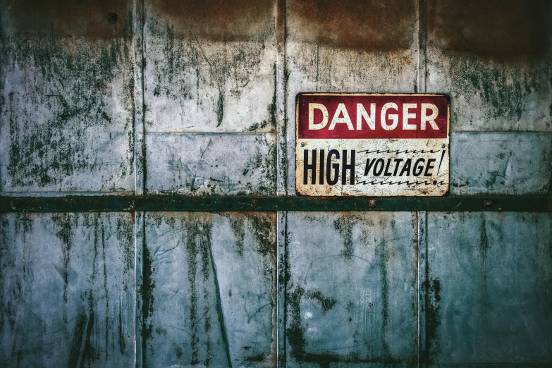 the danger sign is displayed on the wall