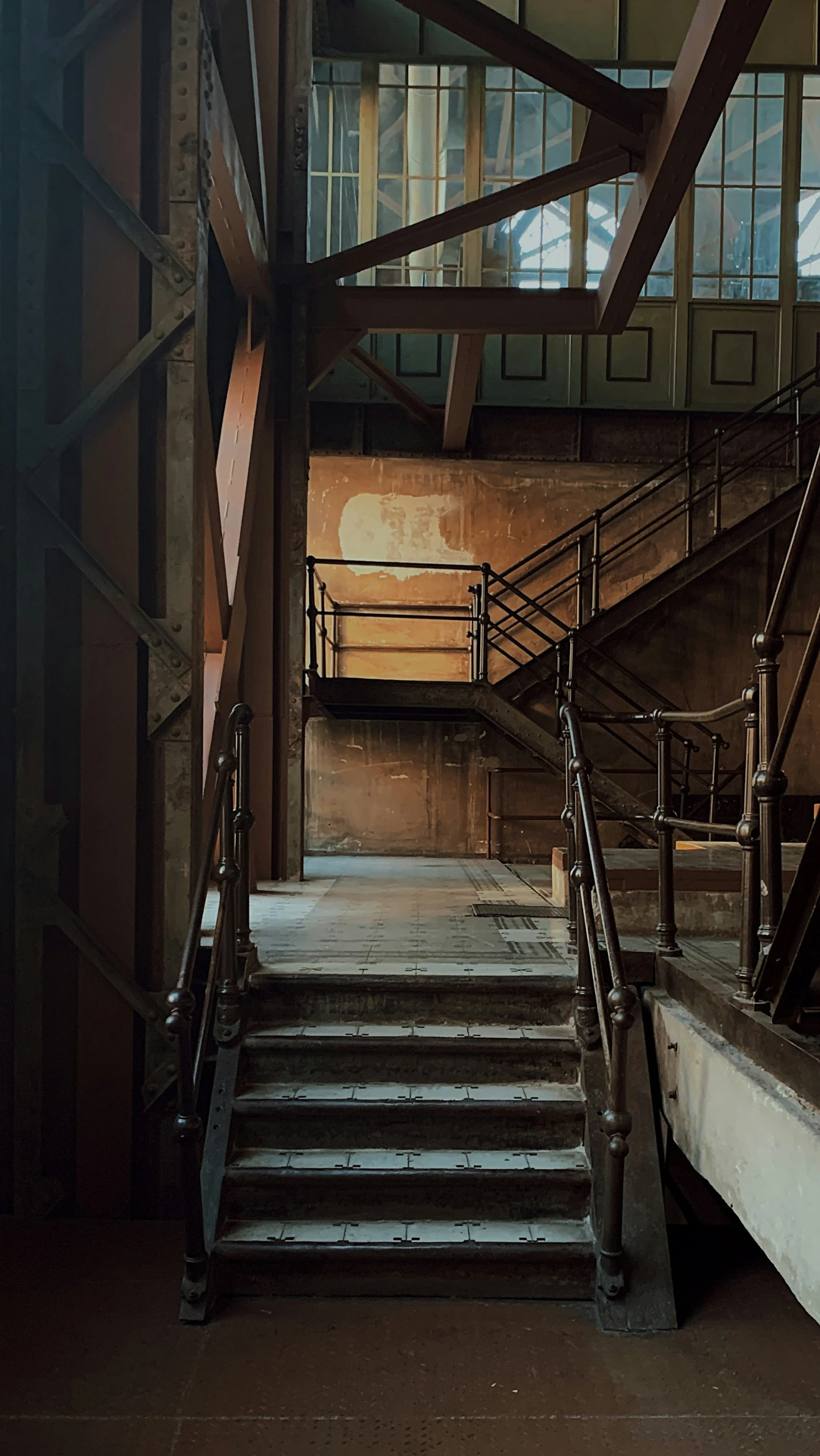 a room filled with lots of stairs next to a wall