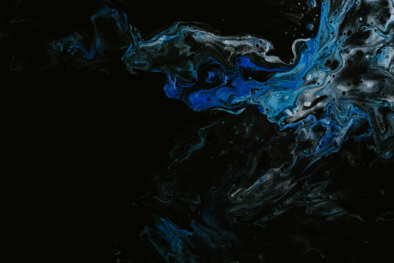 water is splashing off of a black background