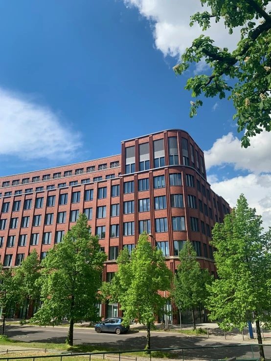 an office building on the corner of a road