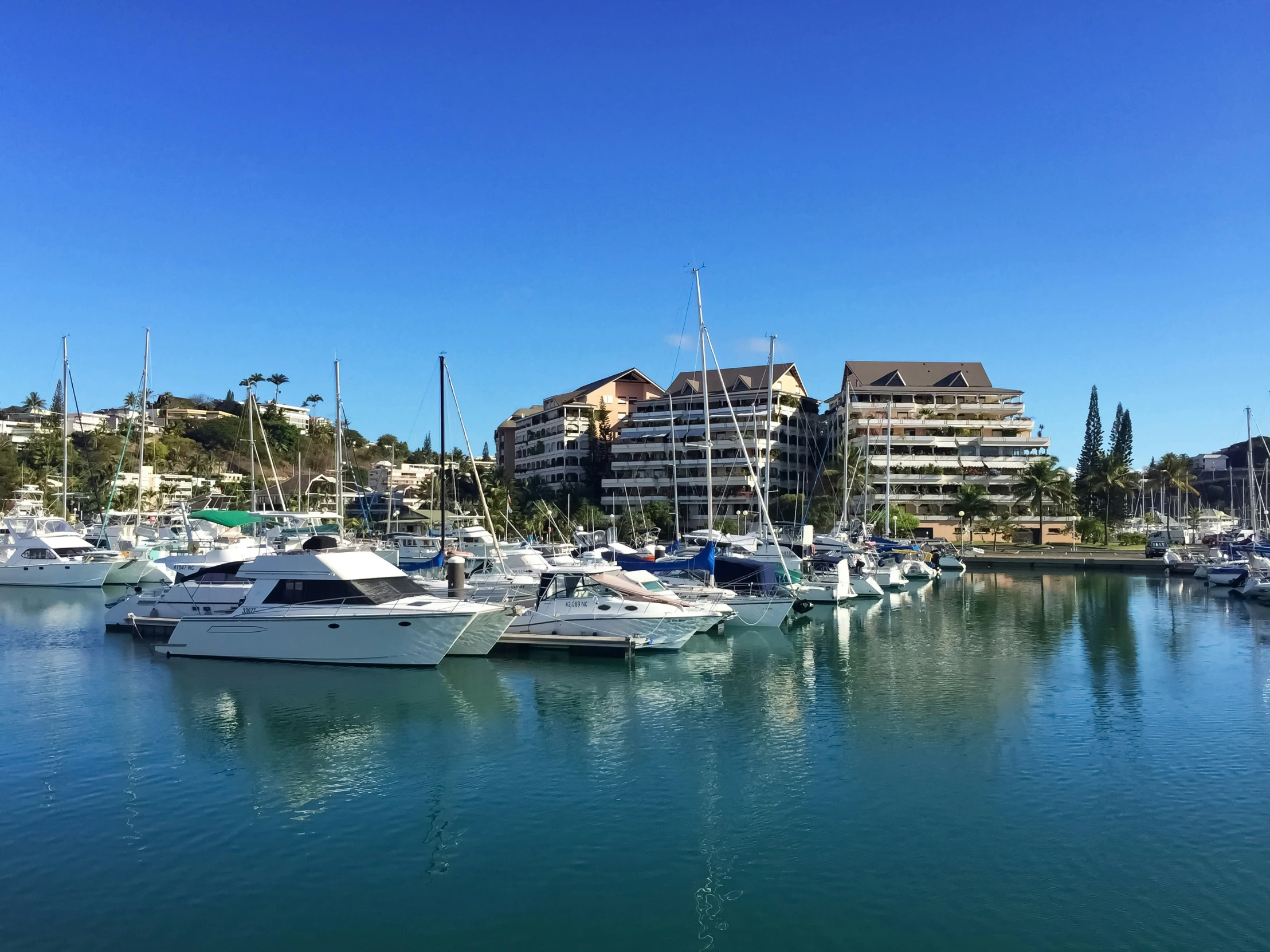 the boats are parked next to each other in the bay