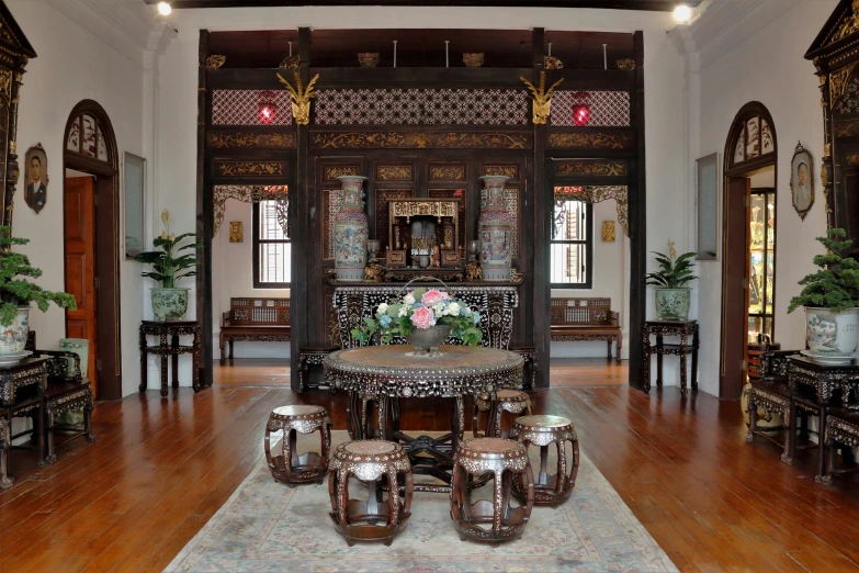 an elegant hall with a round table in the middle