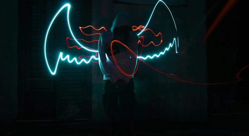 two people with neon lights making faces next to each other