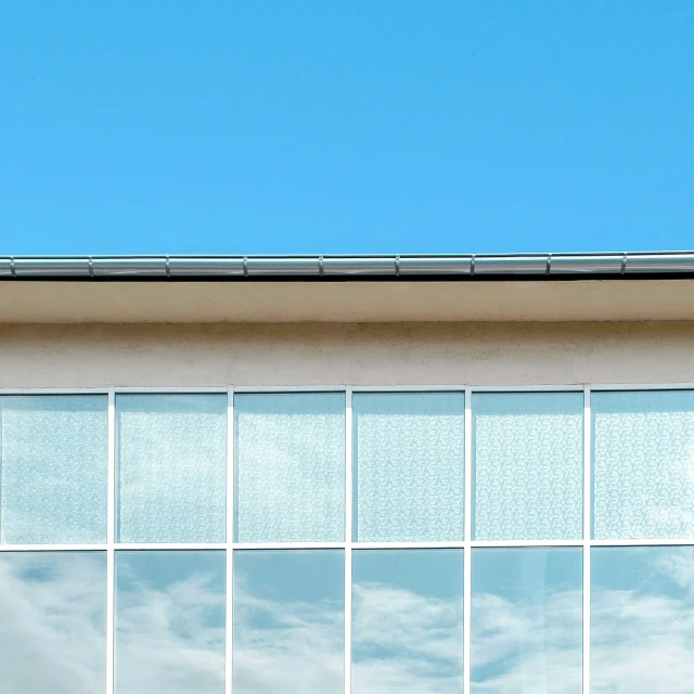 a building has multiple panes of windows, as well as an airplane