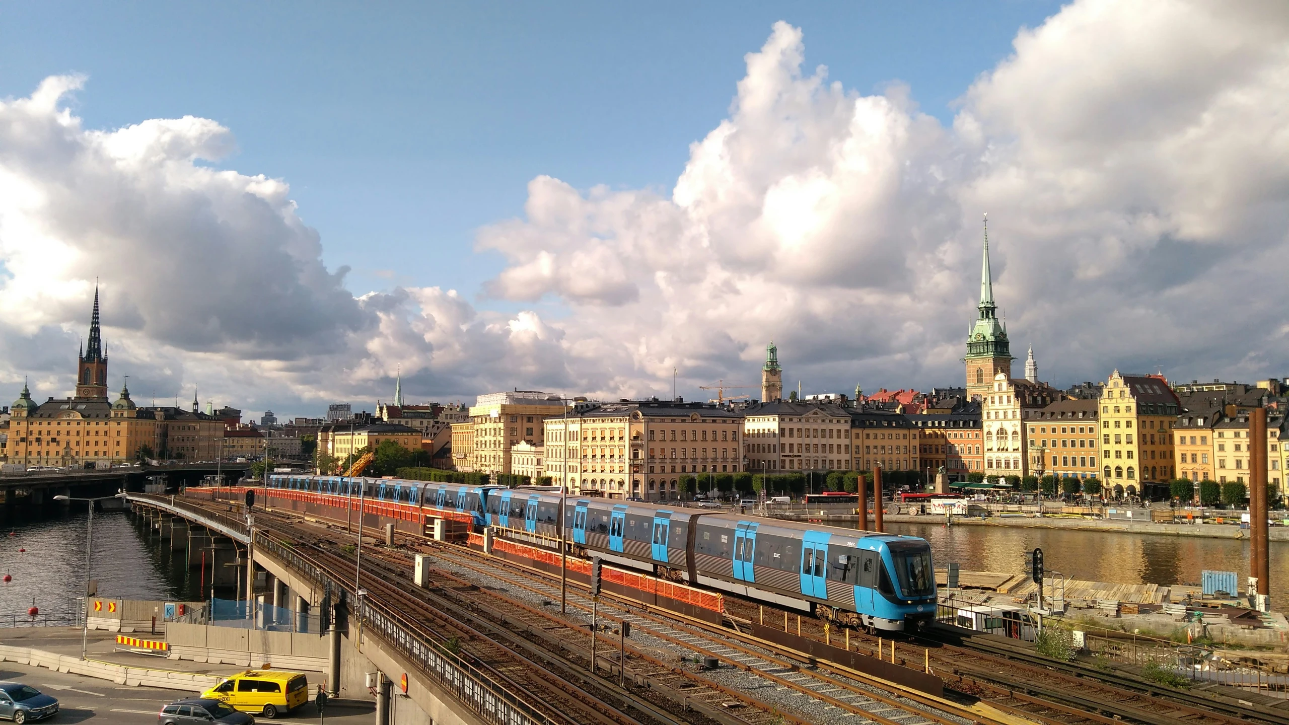 a train on a track going over a bridge