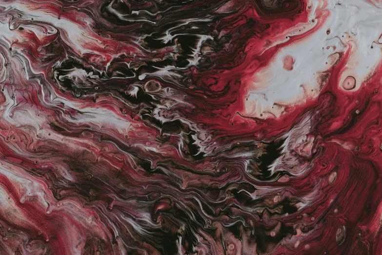 a very colorful painting has red, black and white patterns