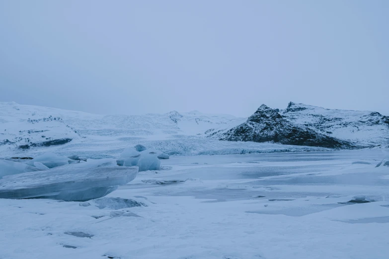 ice floating on the frozen water in a body of water