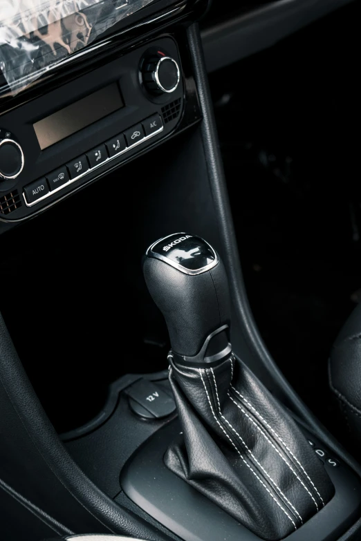 a car seat with an automatic gear lever attached to the dash