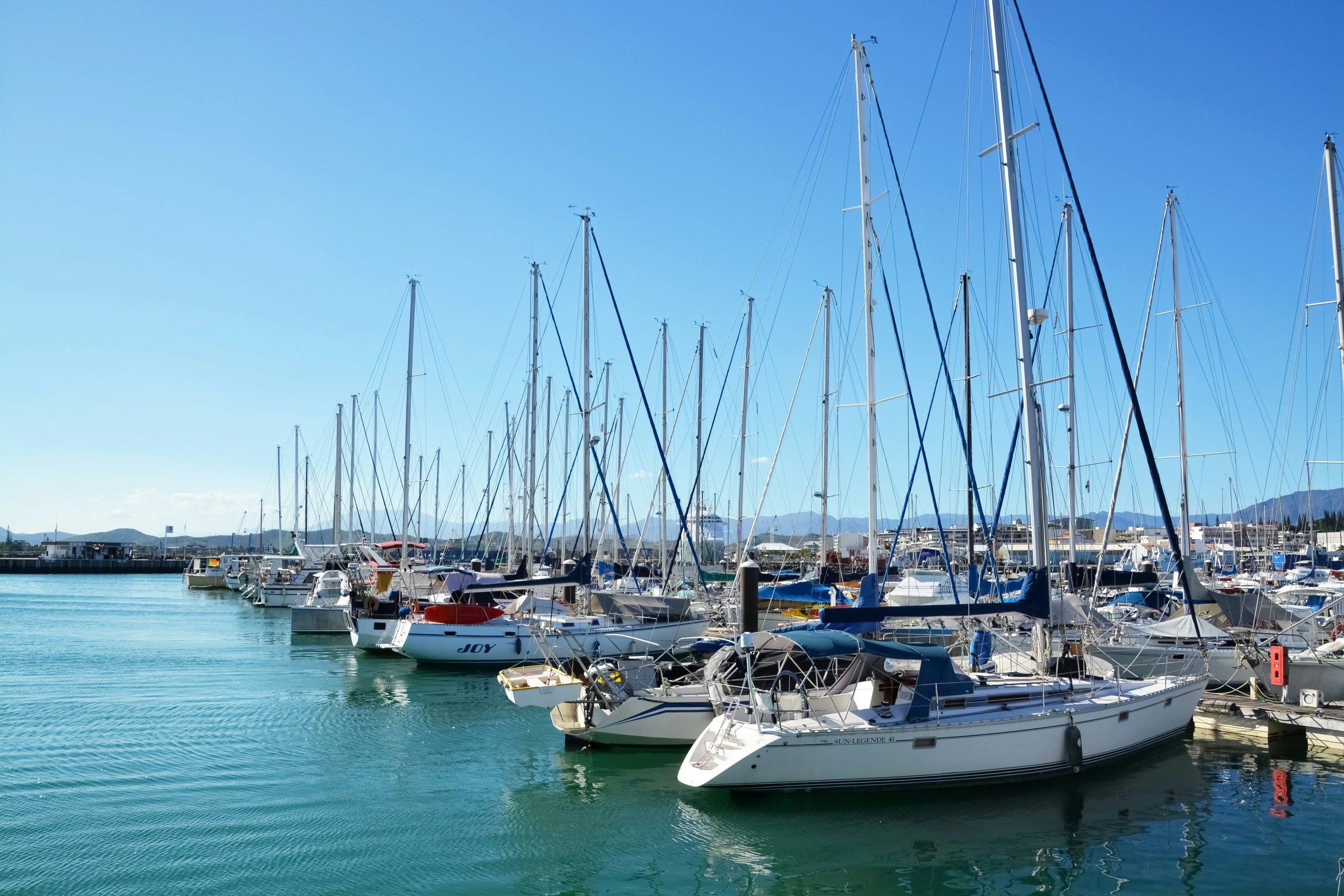 a bunch of boats parked in the water