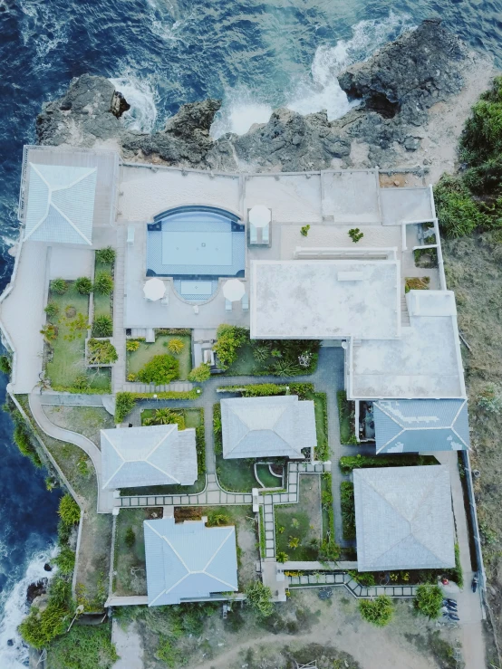 a house and a small pool by the water