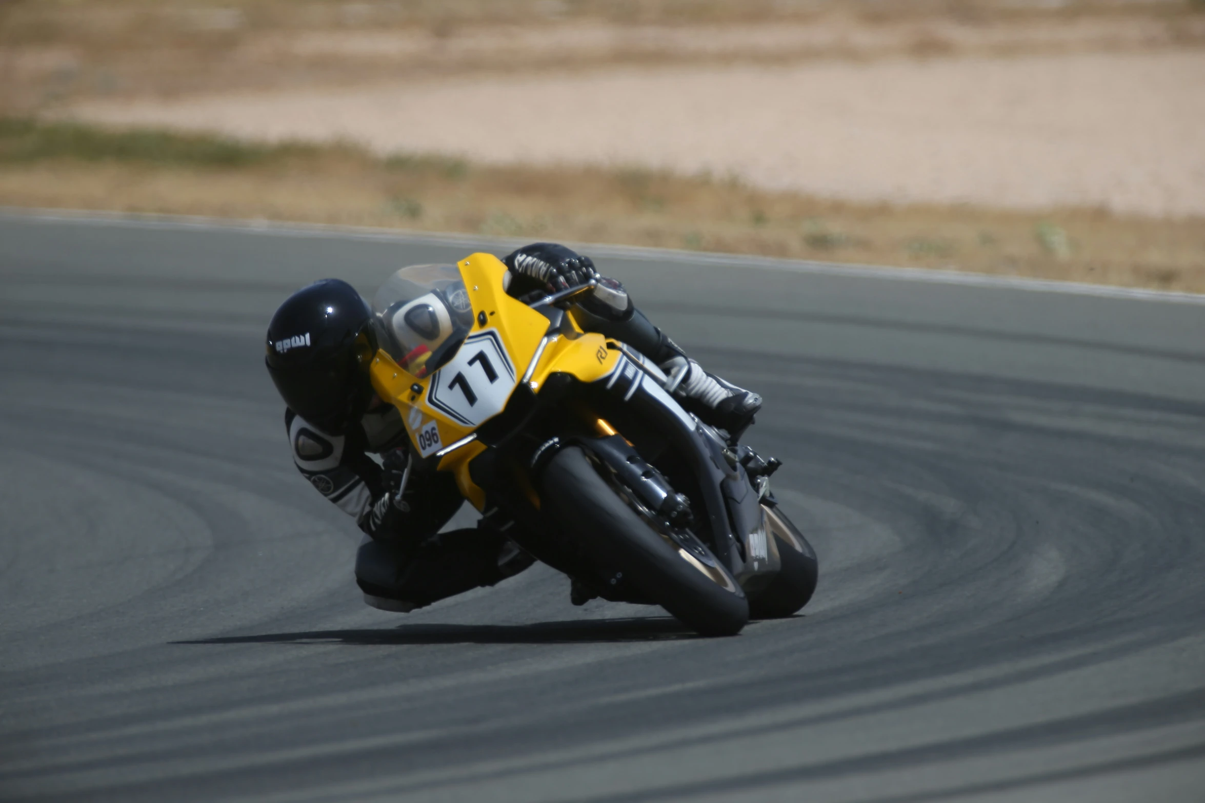 a person is riding a motorcycle on the track