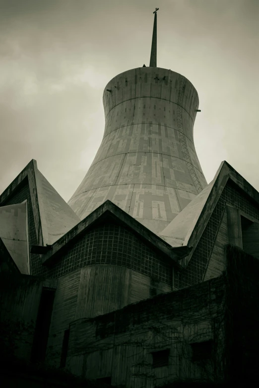 the top of an old building has a spire