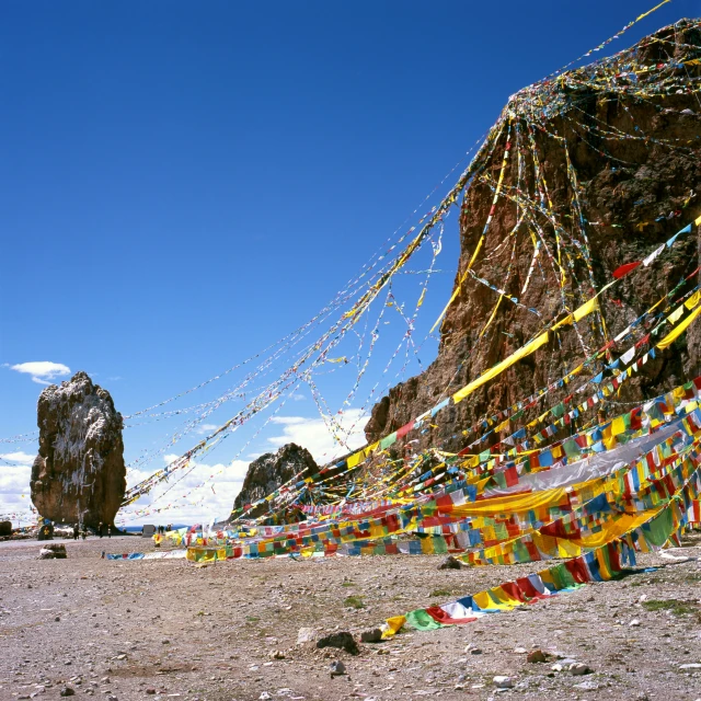 a large rock with a kite on it