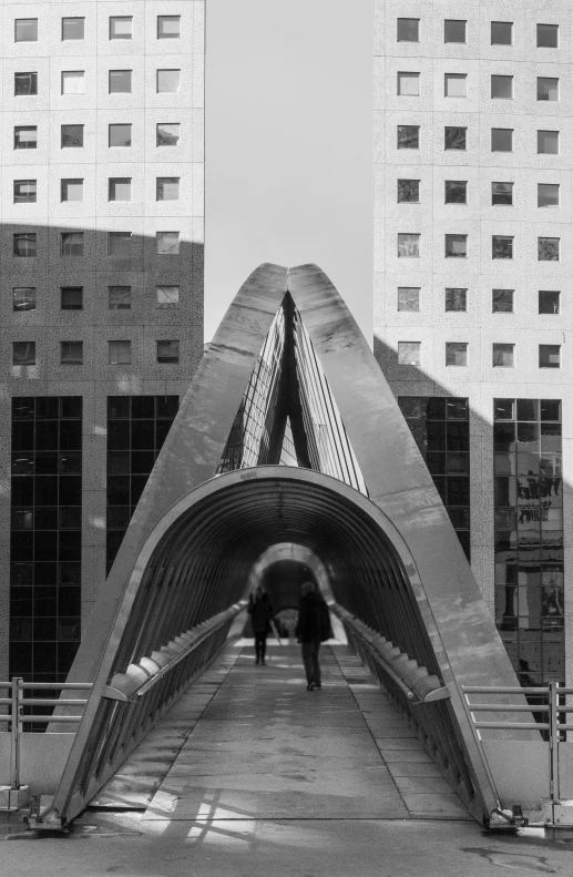 an open sidewalk covered in a triangular walkway