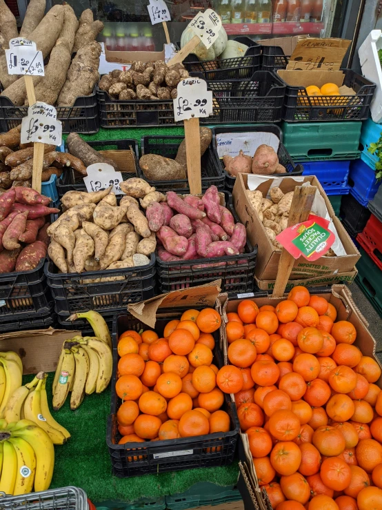 many fruits and vegetables are displayed in baskets