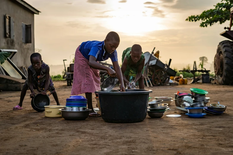 some people preparing food on a field outside