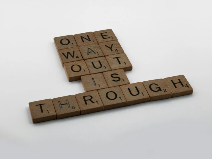 a group of scrabble tiles that spell out words