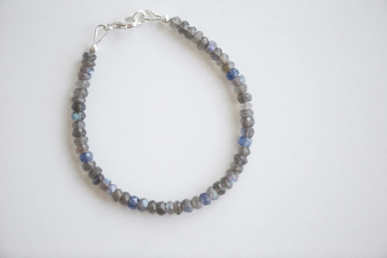 a beaded necklace that has blue stones on it