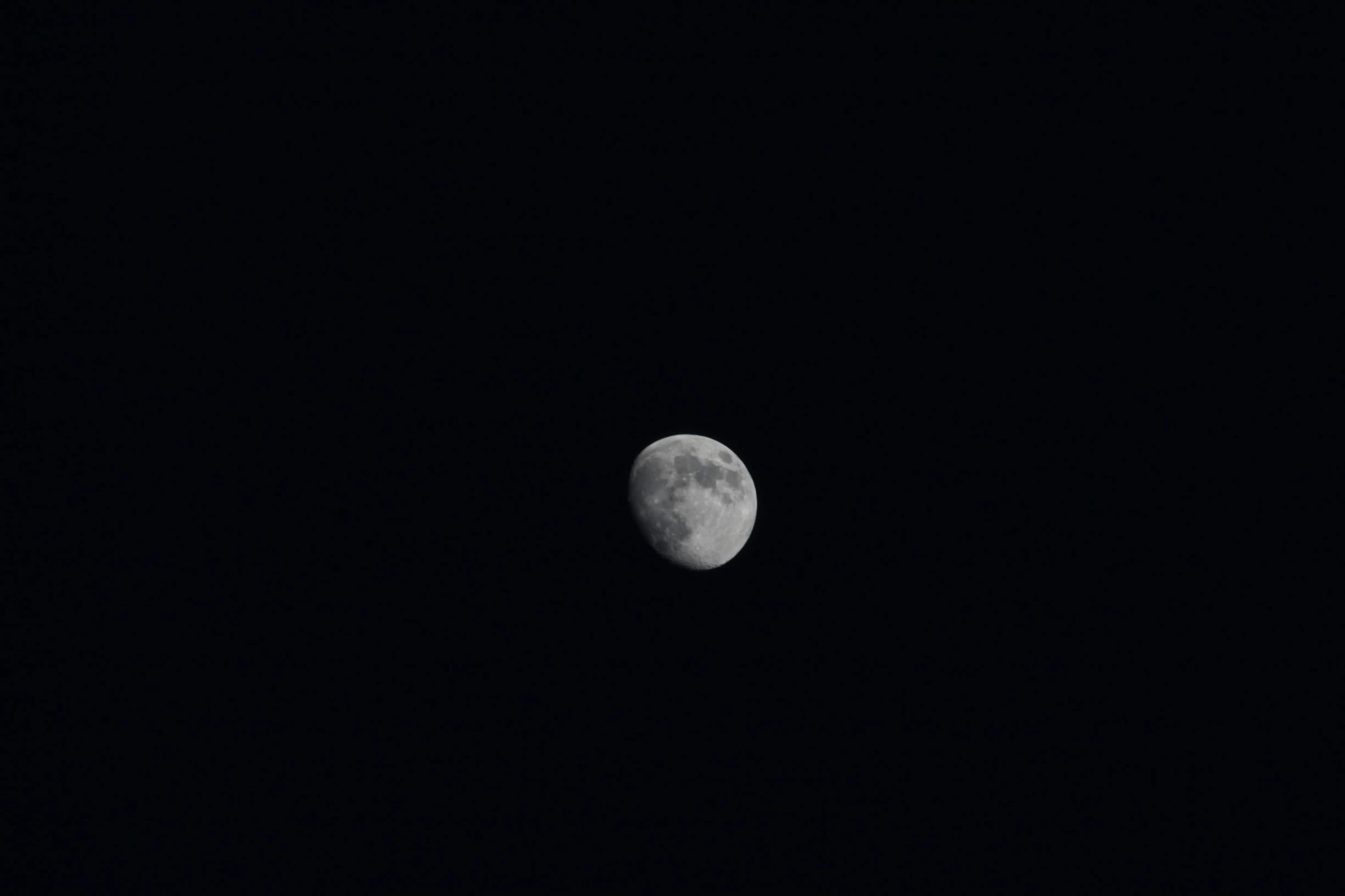 the full moon shines as the dark night sky