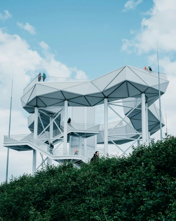 people climbing up and down a tall structure