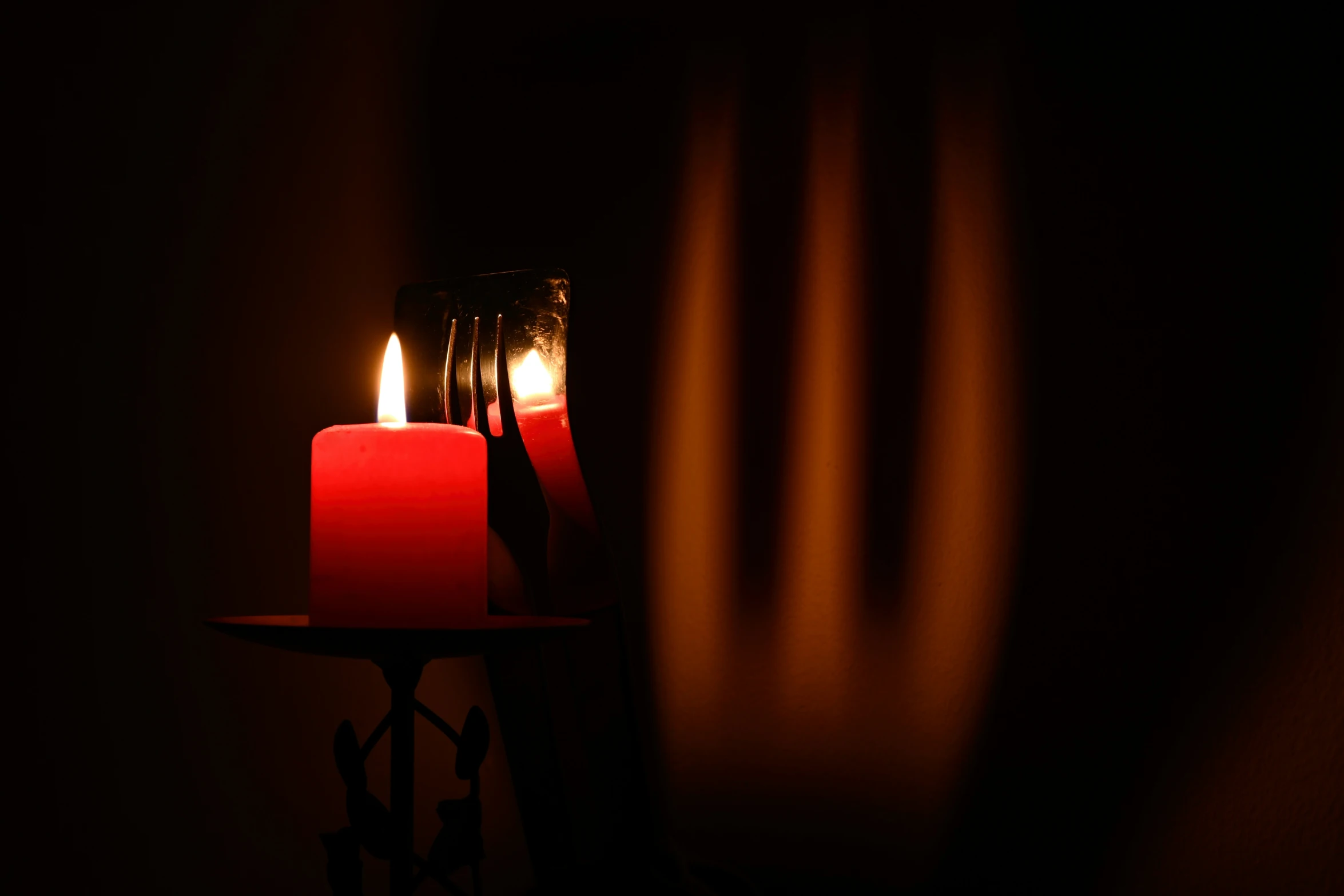 a close up of two candles on a table