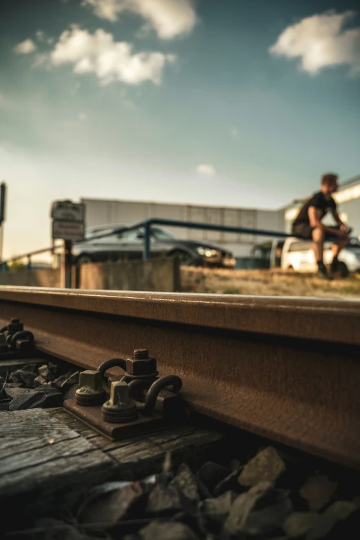 a man sitting on a rail while riding a bike