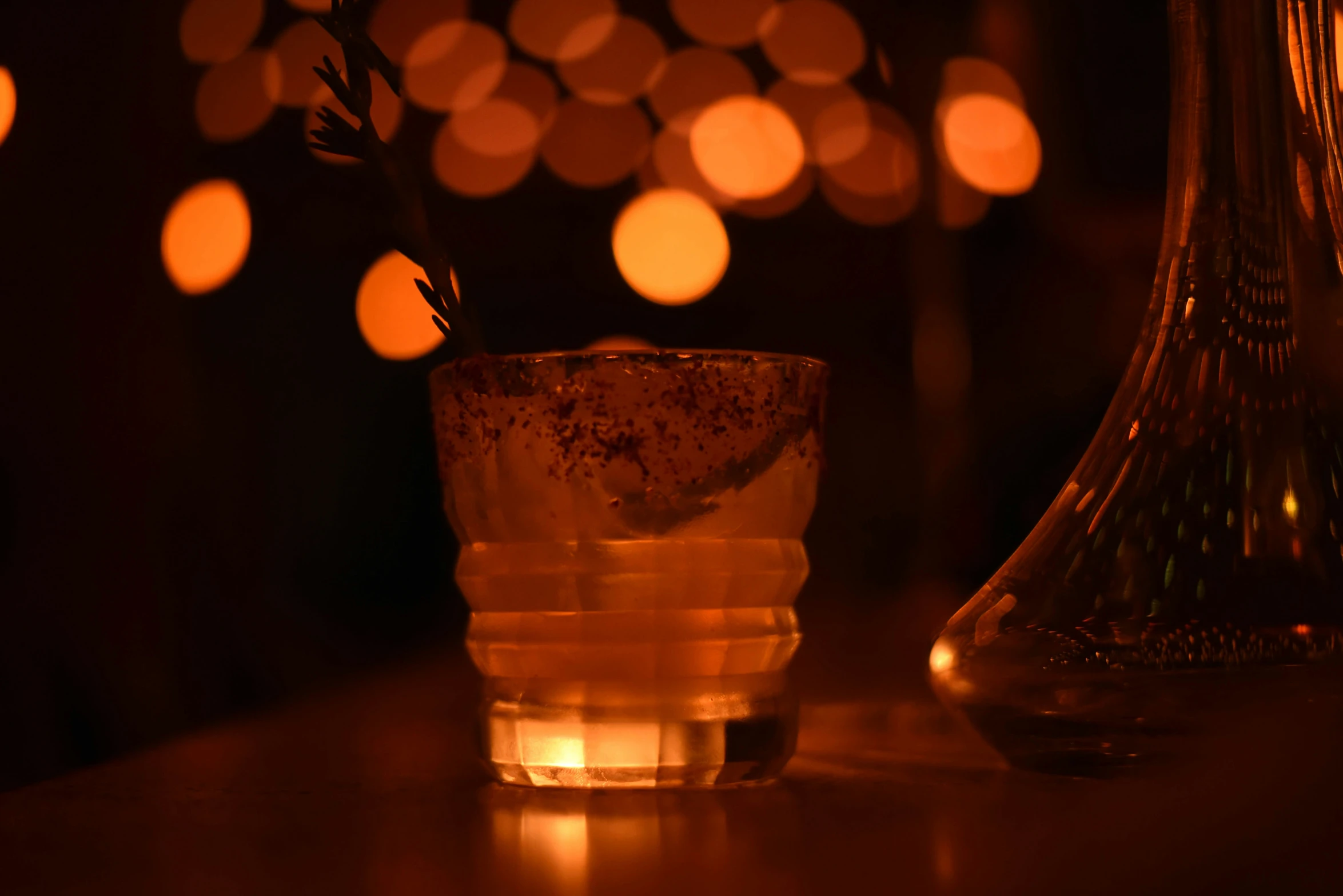 a bottle and a glass on a table