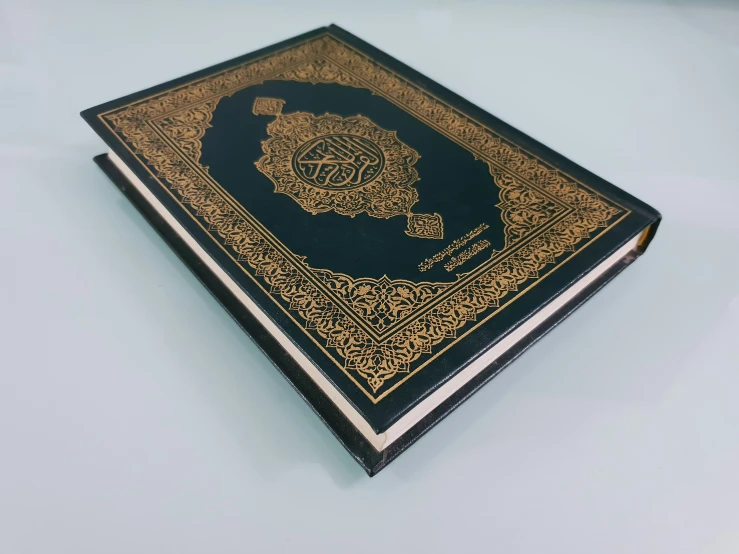 the old book is covered in gold thread