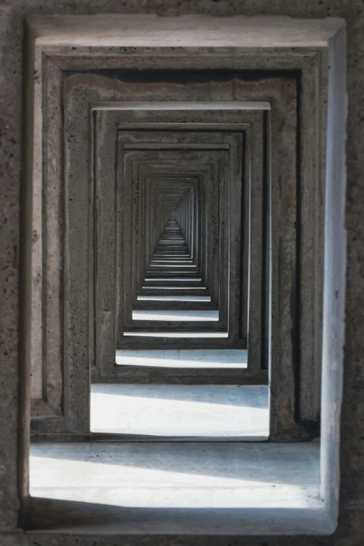 a long walkway filled with lots of grey bricks