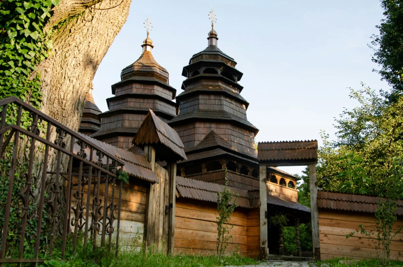 an old looking building with two towers near by