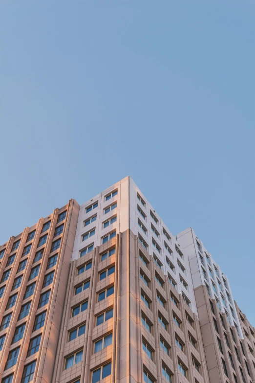 a very tall building next to another big building