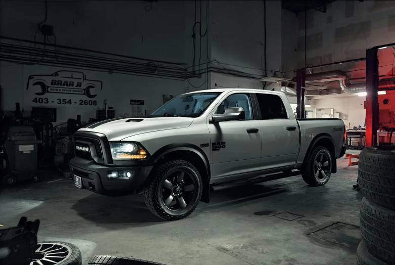 a white dodge truck in a garage at night