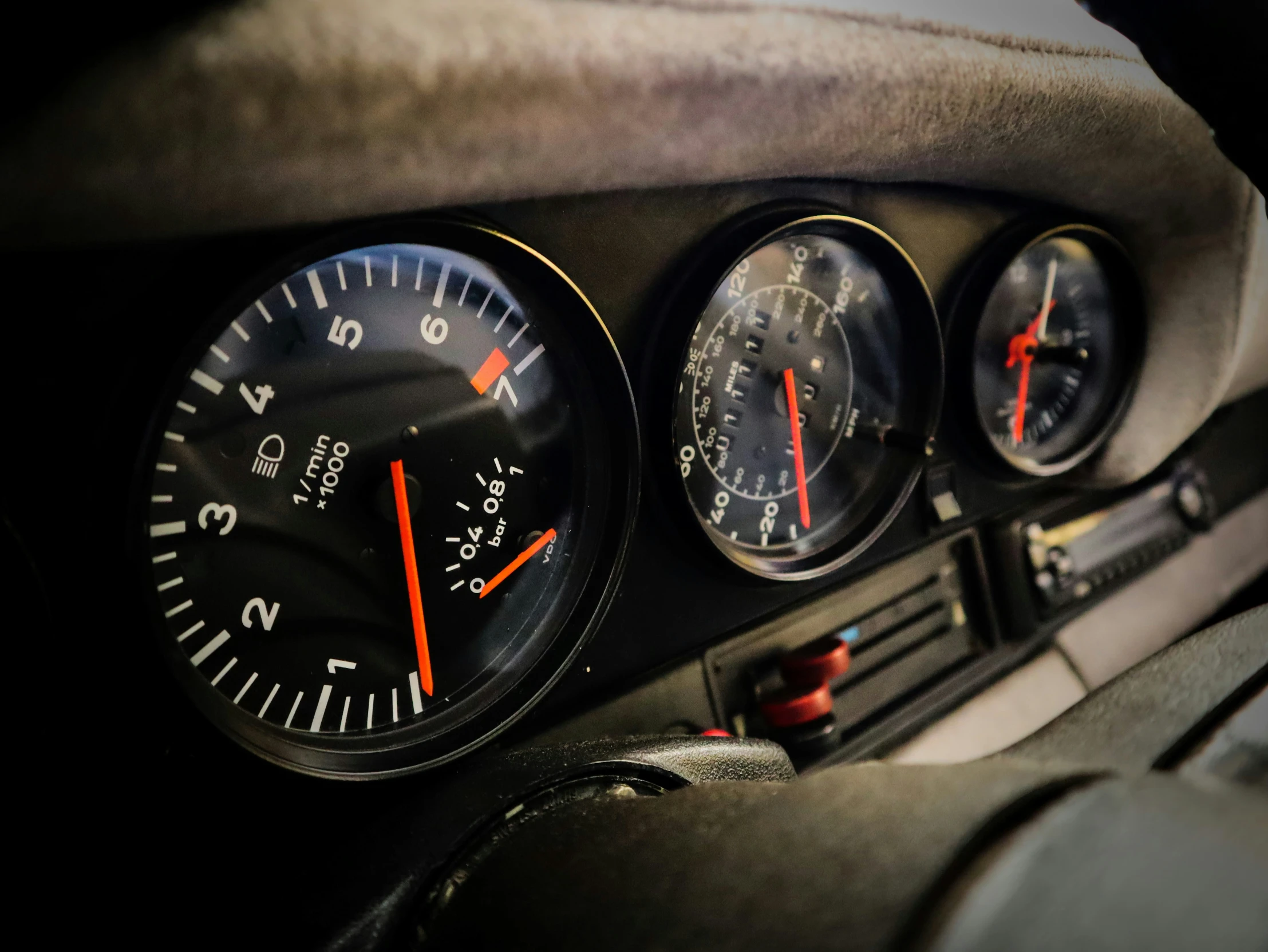 the dashboard of a car showing four speed and two dash meters