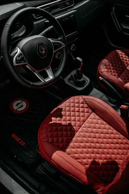 car interior with several red cloth car mats on the floor