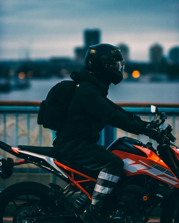 man wearing a black helmet on his motorcycle