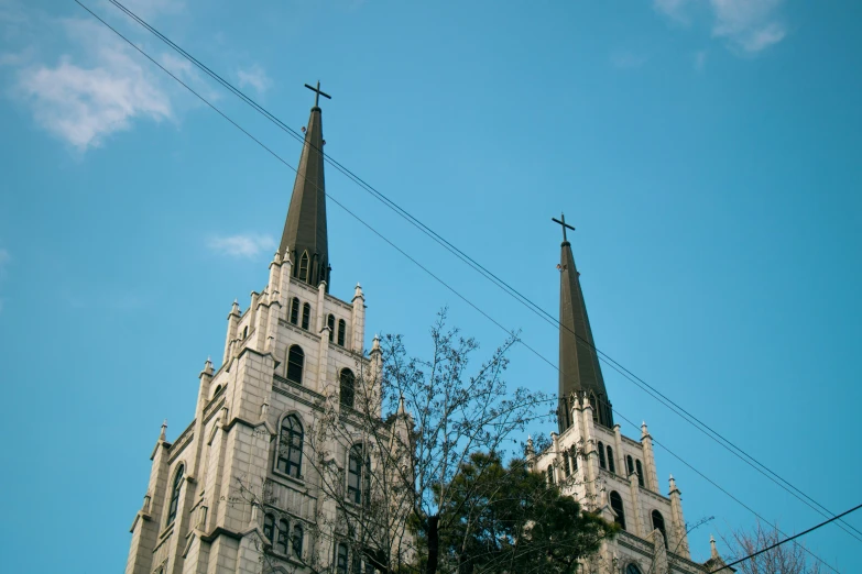 the sky is blue and cloudy outside of the cathedral