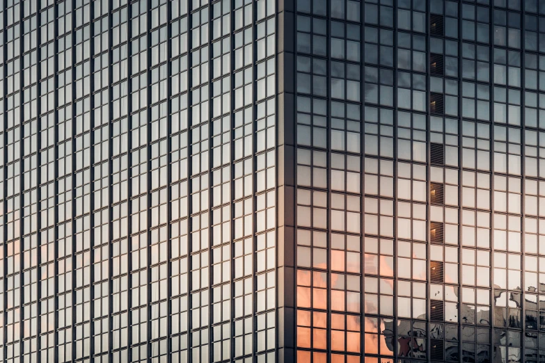 reflection of the sky in the windows of the skyscr