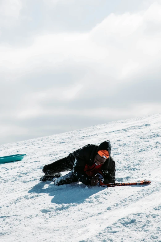 a person on skis is laying in the snow