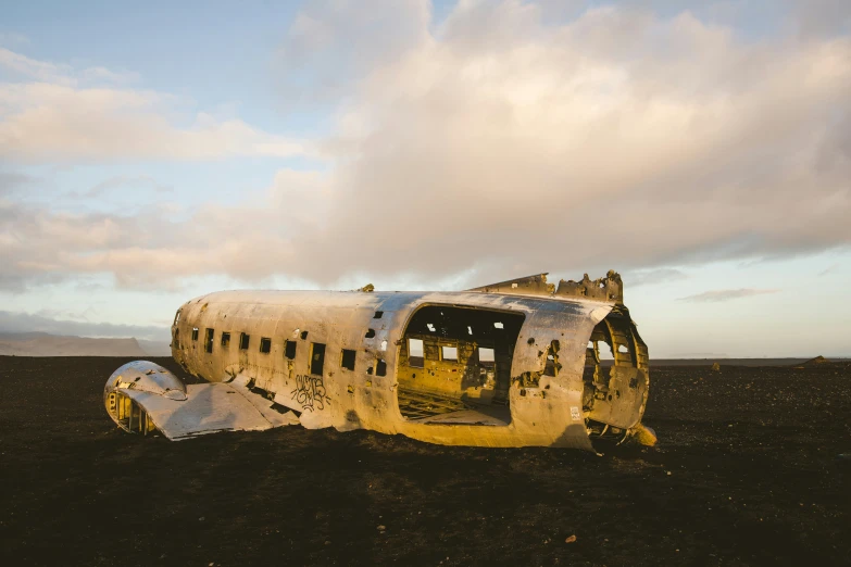 a large airplane in the middle of an open field