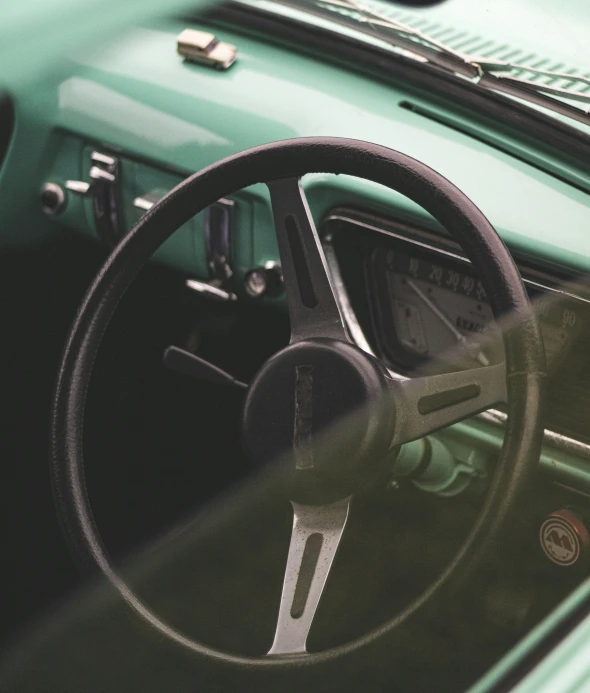 this is an image of a green car with the dashboard wheel turned