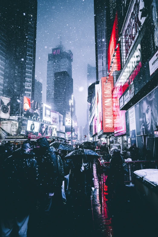 people on a crowded street in the rain