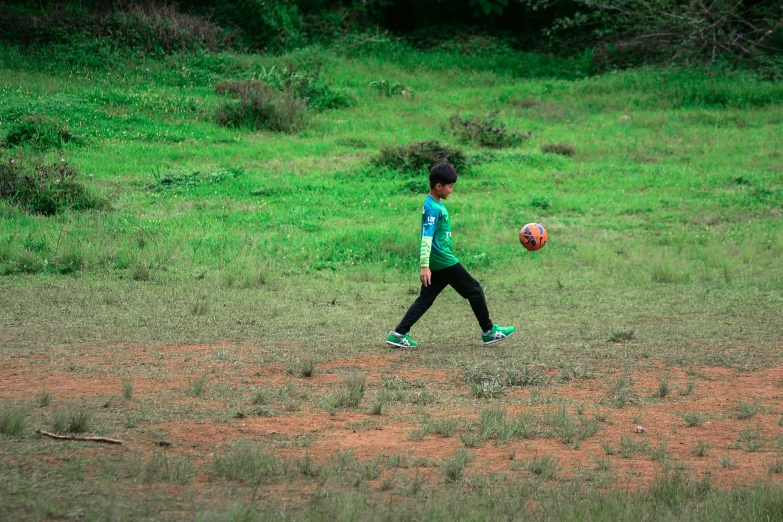 a young child is playing with a ball